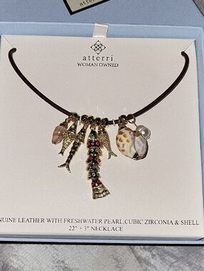 Atterri Gold Seashell & Pearl Charm Necklace on Brown Leather Ti